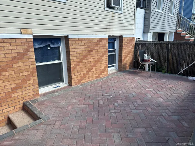 a view of backyard of house and garage