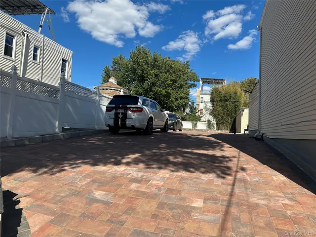 a view of street with parked cars