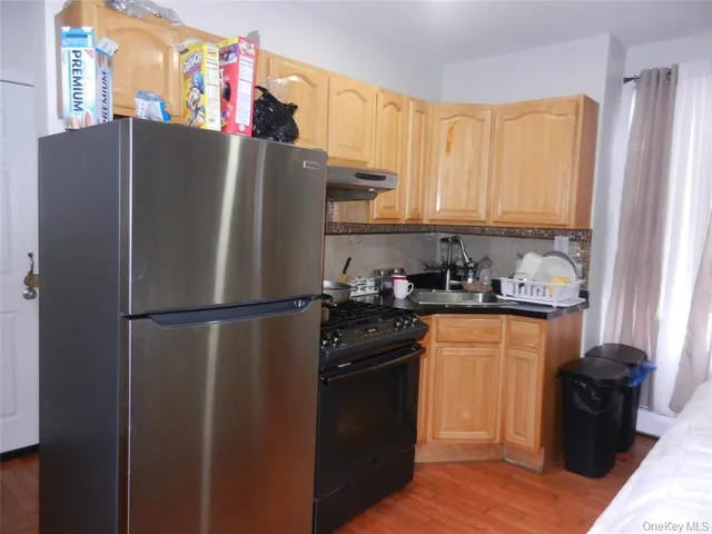 a white refrigerator freezer sitting in a kitchen