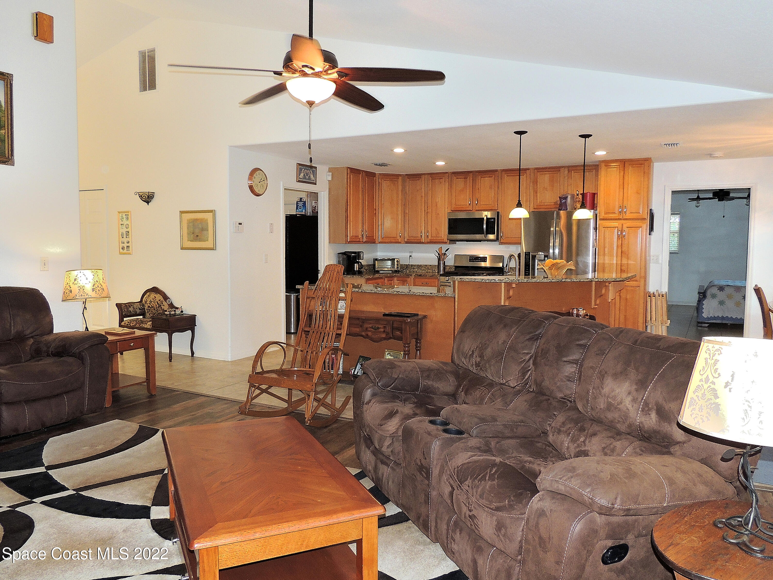 2473 Harlock Road Melbourne, FL 32934 - Photo 45 of 45 a living room with furniture and kitchen view
