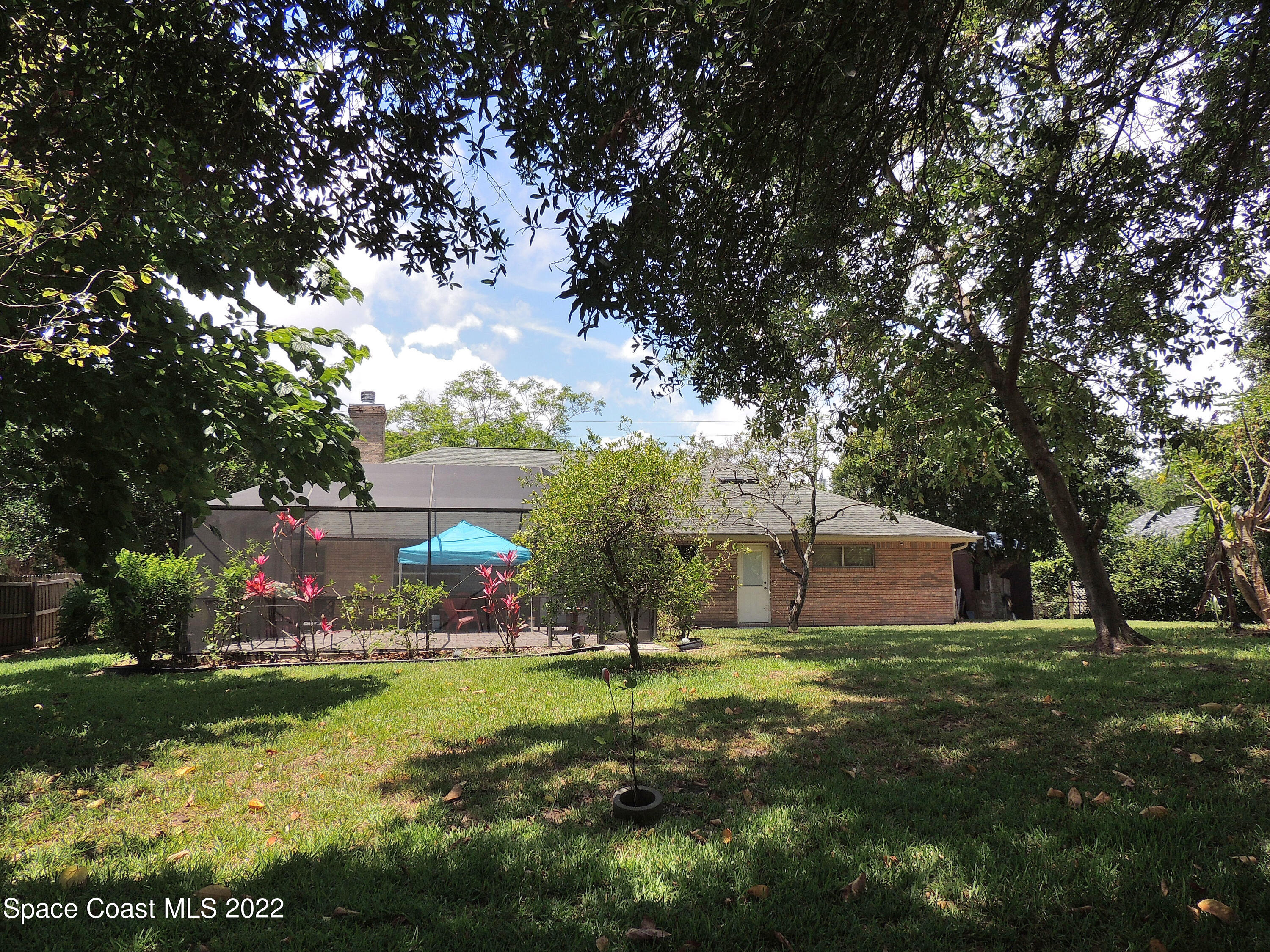 2473 Harlock Road Melbourne, FL 32934 - Photo 32 of 45 a view of a house with a big yard
