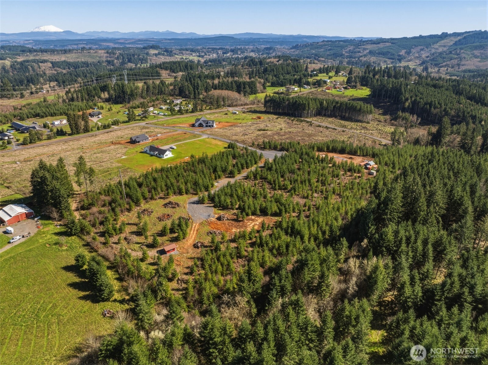 128 Brim Ridge Lane Winlock, WA 98596 - Photo 8 of 11 a view of a lake with mountains in the background