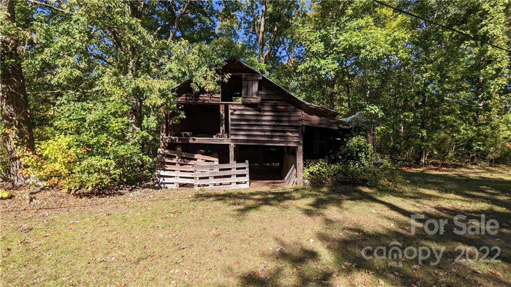 3137 Pink Plyler Road Lancaster, SC 29720 - Photo 17 of 20 a view of a house with a small yard and sitting area