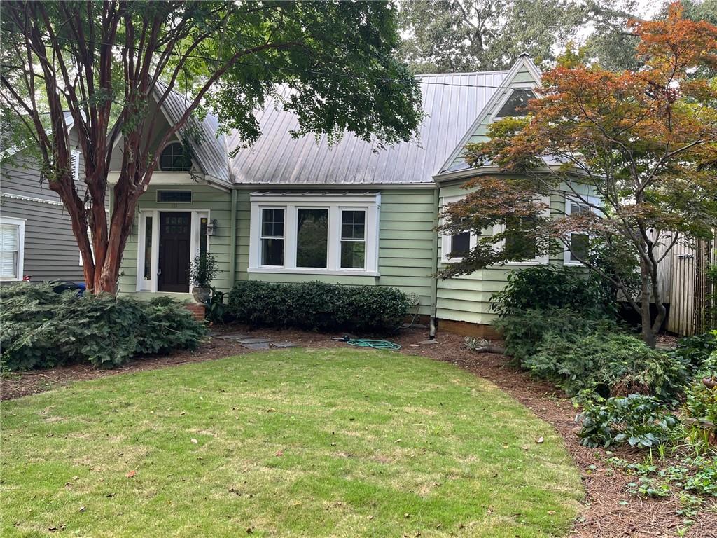 136 Fairview Avenue Decatur, GA 30030 - Photo 1 of 1 a front view of a house with garden