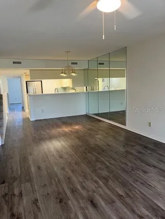 a view of a livingroom with wooden floor
