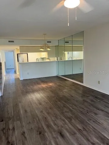 a view of a livingroom with wooden floor