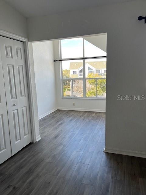 14839 Seminole Trail Seminole, FL 33776 - Photo 15 of 35 a view of an empty room with wooden floor and a window