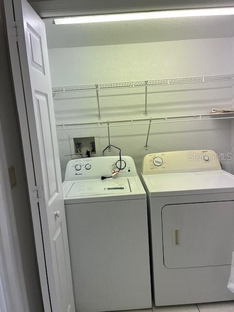 14839 Seminole Trail Seminole, FL 33776 - Photo 19 of 35 a utility room with dryer and washer
