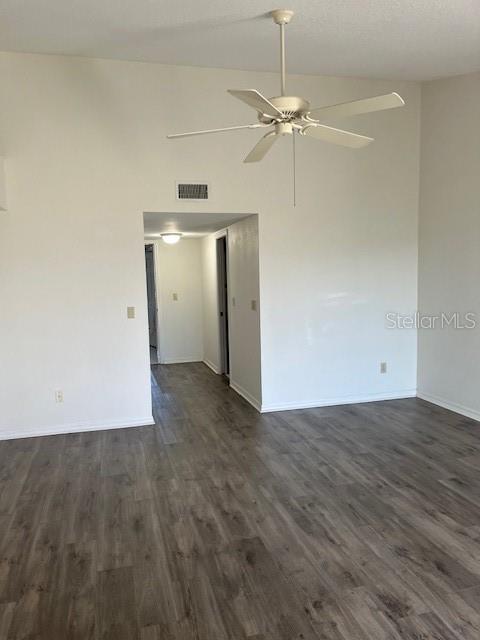 14839 Seminole Trail Seminole, FL 33776 - Photo 25 of 35 an empty room with an entryway and a ceiling fan