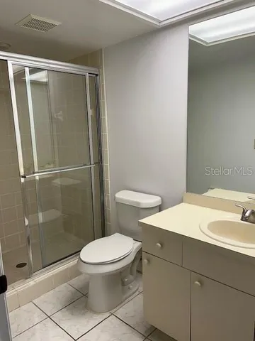 a bathroom with a shower and toilet