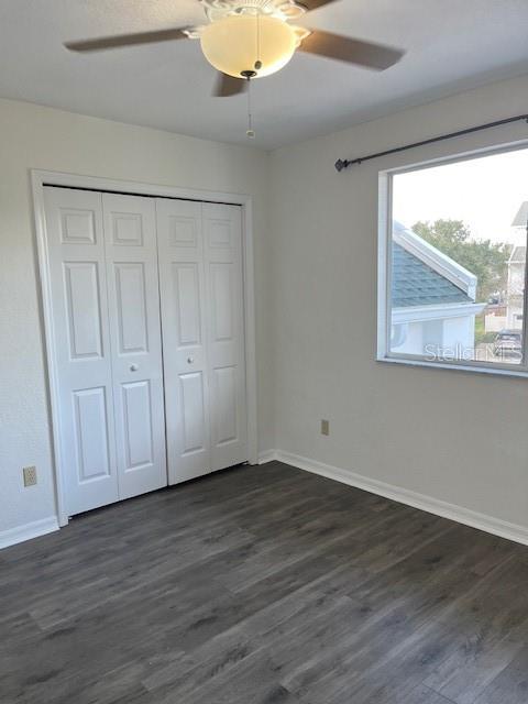 14839 Seminole Trail Seminole, FL 33776 - Photo 7 of 35 a view of an empty room with wooden floor and a window
