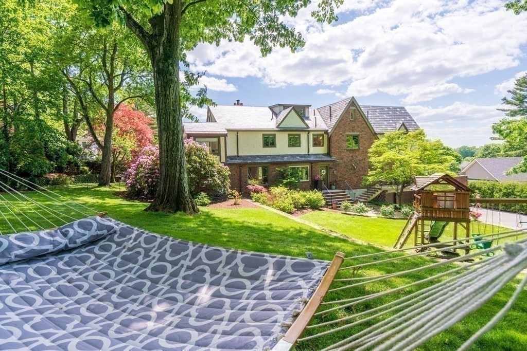 32 Maugus Avenue Wellesley, MA 02481 - Photo 9 of 42 a front view of a house with garden