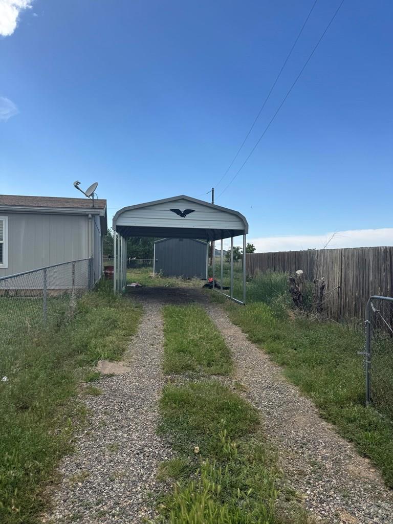 28983 County Road Aguilar, CO 81020 - Photo 4 of 24 a backyard of a house with yard and trampoline