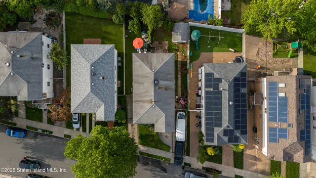 an aerial view of houses with outdoor space