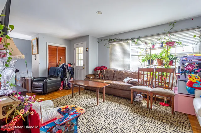 a living room filled with furniture and a rug