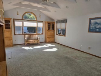 1 Ridgehill Road Canton, MA 02021 - Photo 12 of 39 an empty room with large windows and wooden floor