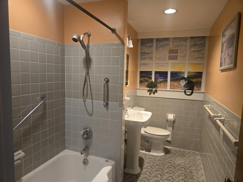 1 Ridgehill Road Canton, MA 02021 - Photo 21 of 39 a bathroom with a sink a toilet and shower