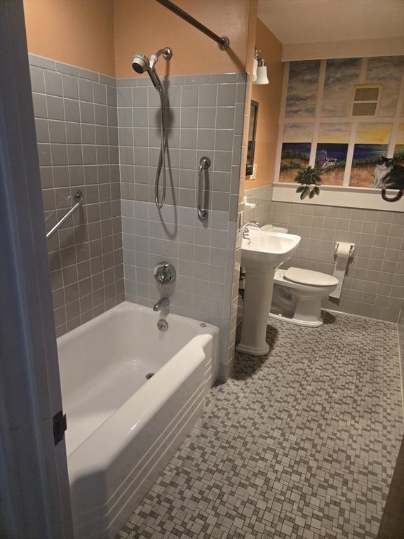 1 Ridgehill Road Canton, MA 02021 - Photo 22 of 39 a bathroom with a sink a toilet and shower