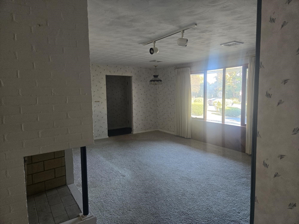 1 Ridgehill Road Canton, MA 02021 - Photo 5 of 39 an empty room with windows and cabinet