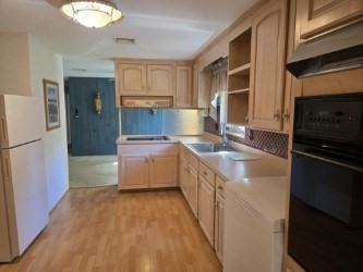 1 Ridgehill Road Canton, MA 02021 - Photo 9 of 39 a kitchen with a sink stove and refrigerator