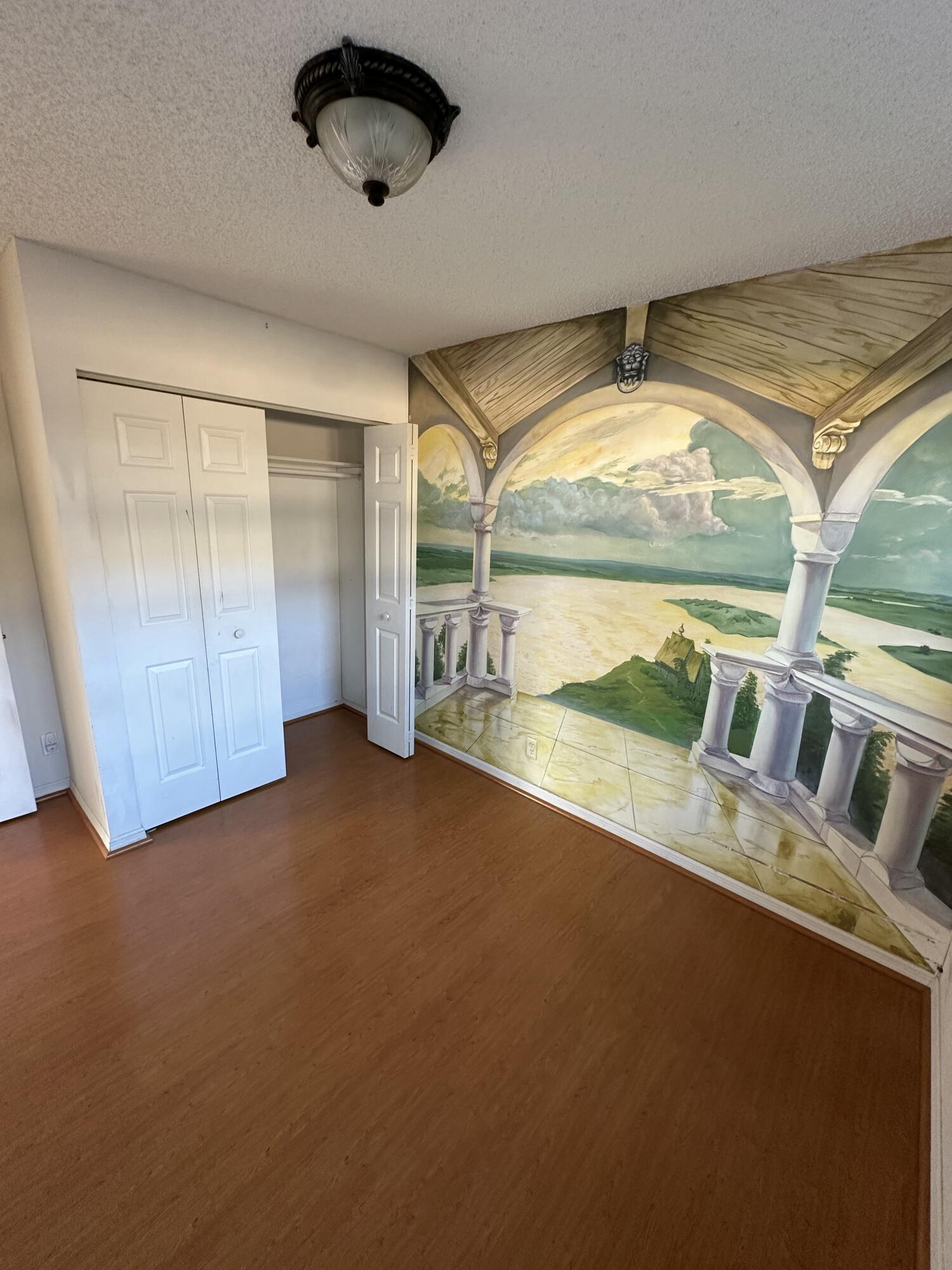 3291 Southwest 4th Street Deerfield Beach, FL 33442 - Photo 12 of 38 an empty room with floor to ceiling windows and pool table