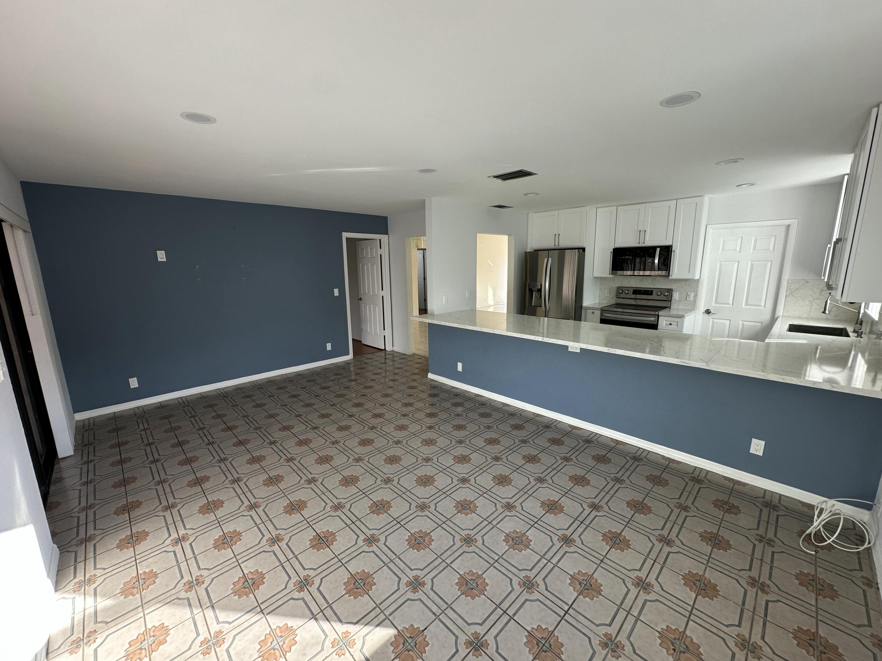 3291 Southwest 4th Street Deerfield Beach, FL 33442 - Photo 18 of 38 a view of a kitchen with microwave and cabinets