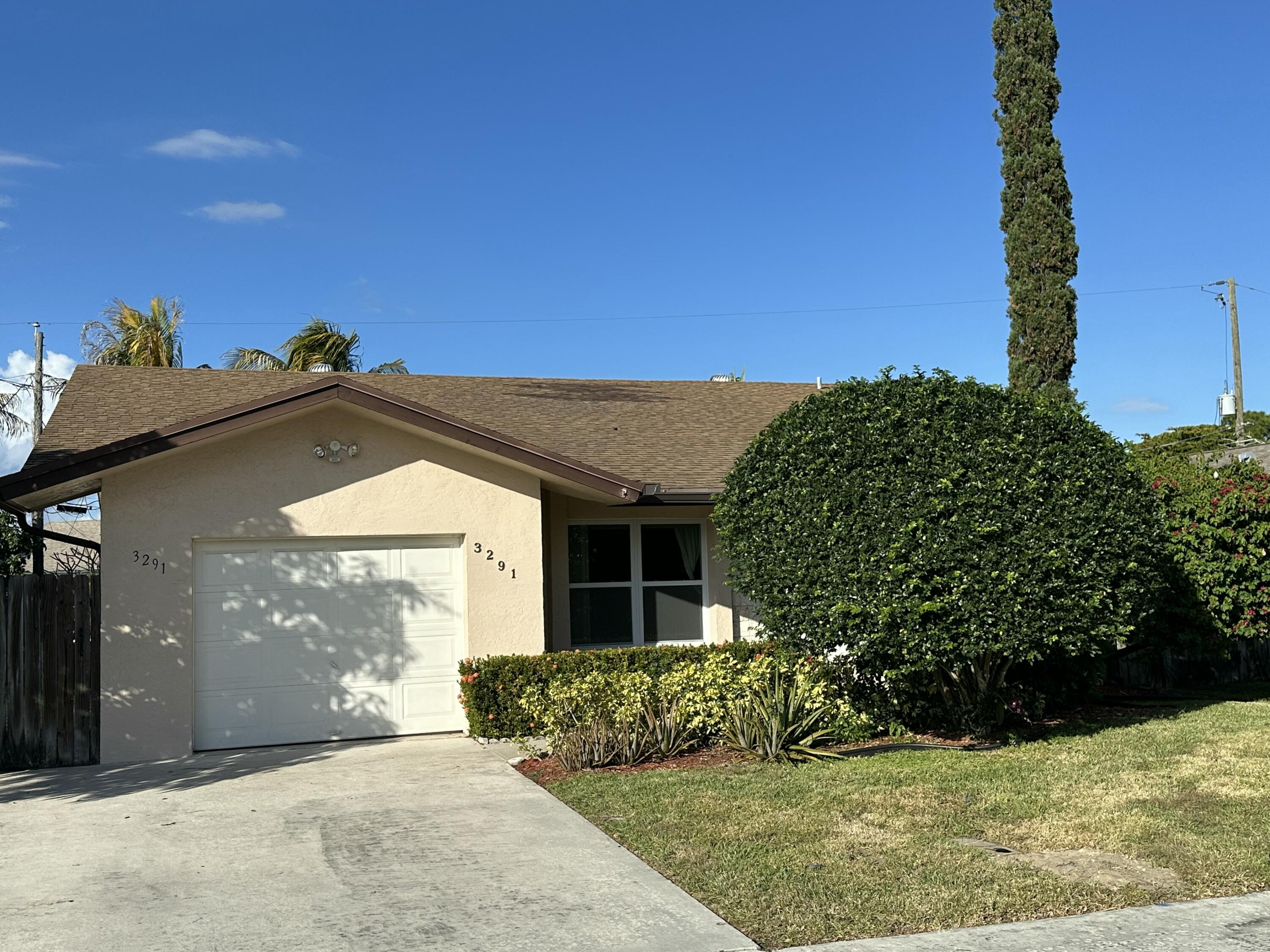 3291 Southwest 4th Street Deerfield Beach, FL 33442 - Photo 2 of 38 a view of a house with a yard