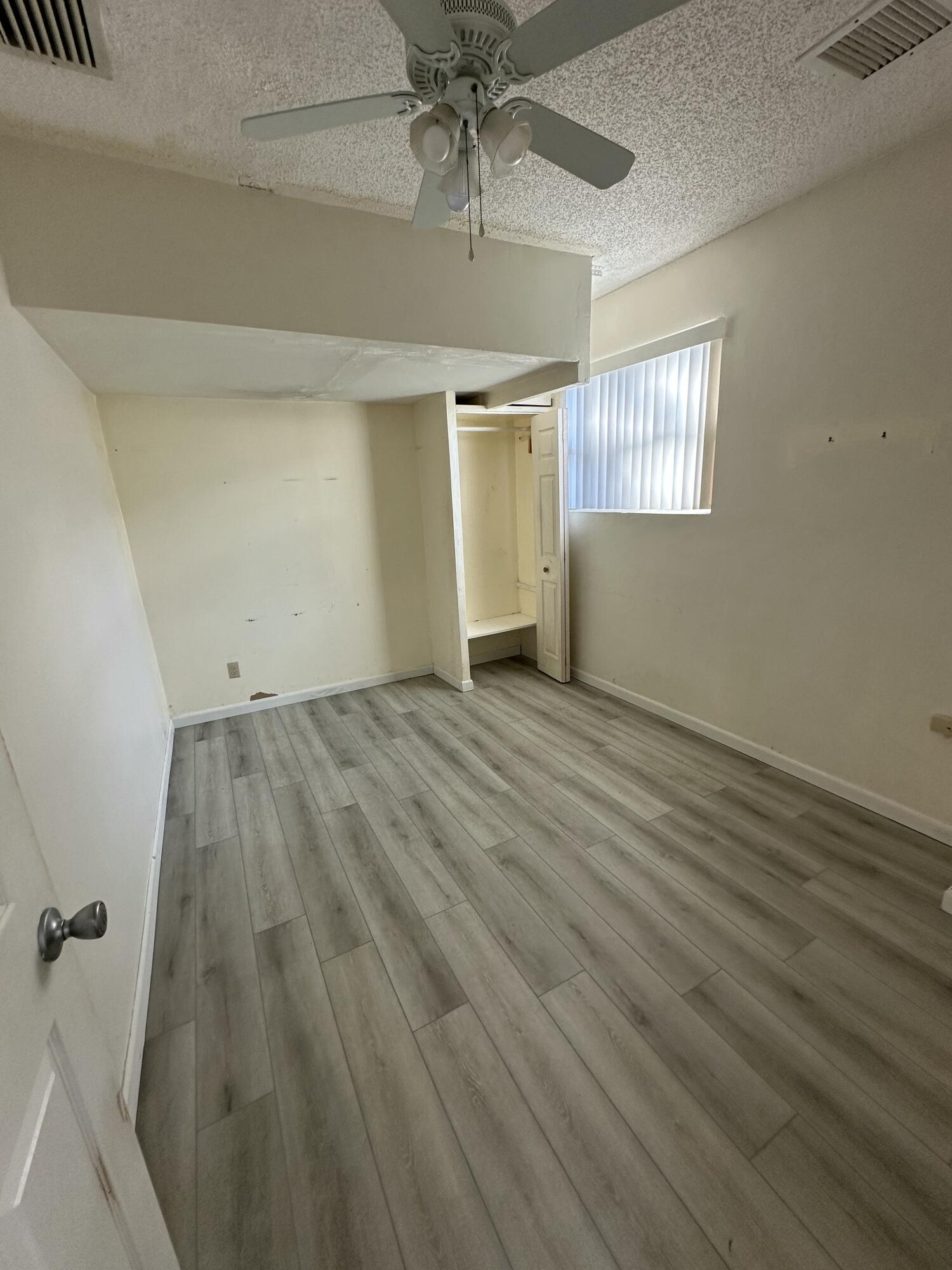 3291 Southwest 4th Street Deerfield Beach, FL 33442 - Photo 28 of 38 wooden floor in an empty room