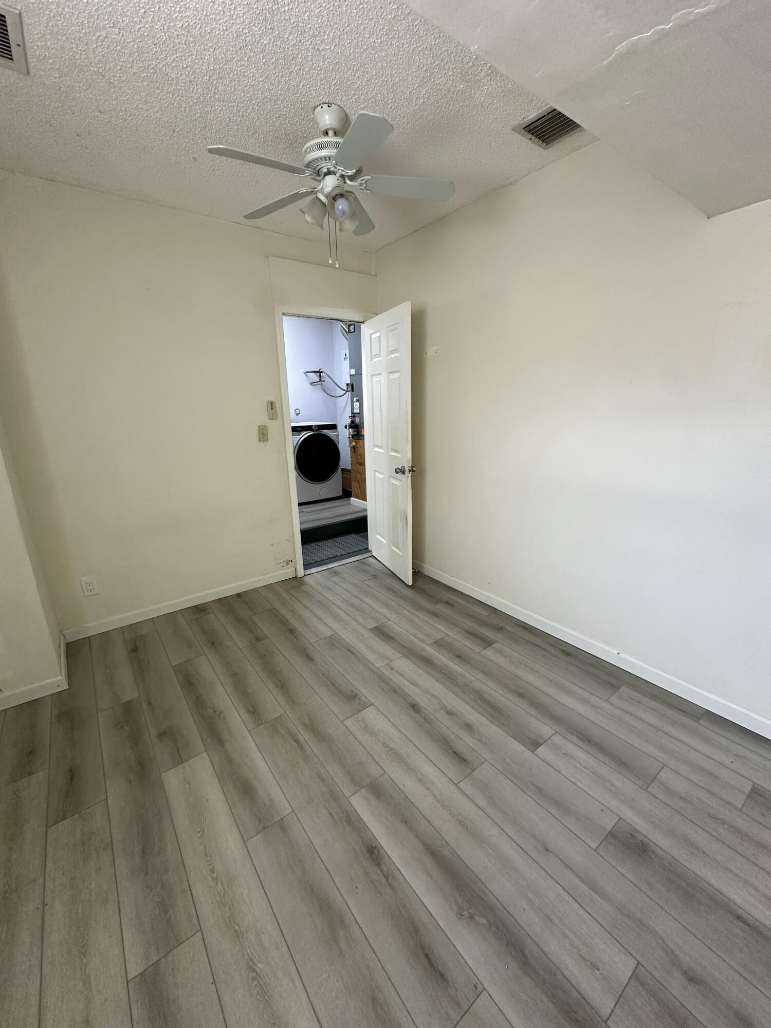 3291 Southwest 4th Street Deerfield Beach, FL 33442 - Photo 29 of 38 wooden floor in an empty room