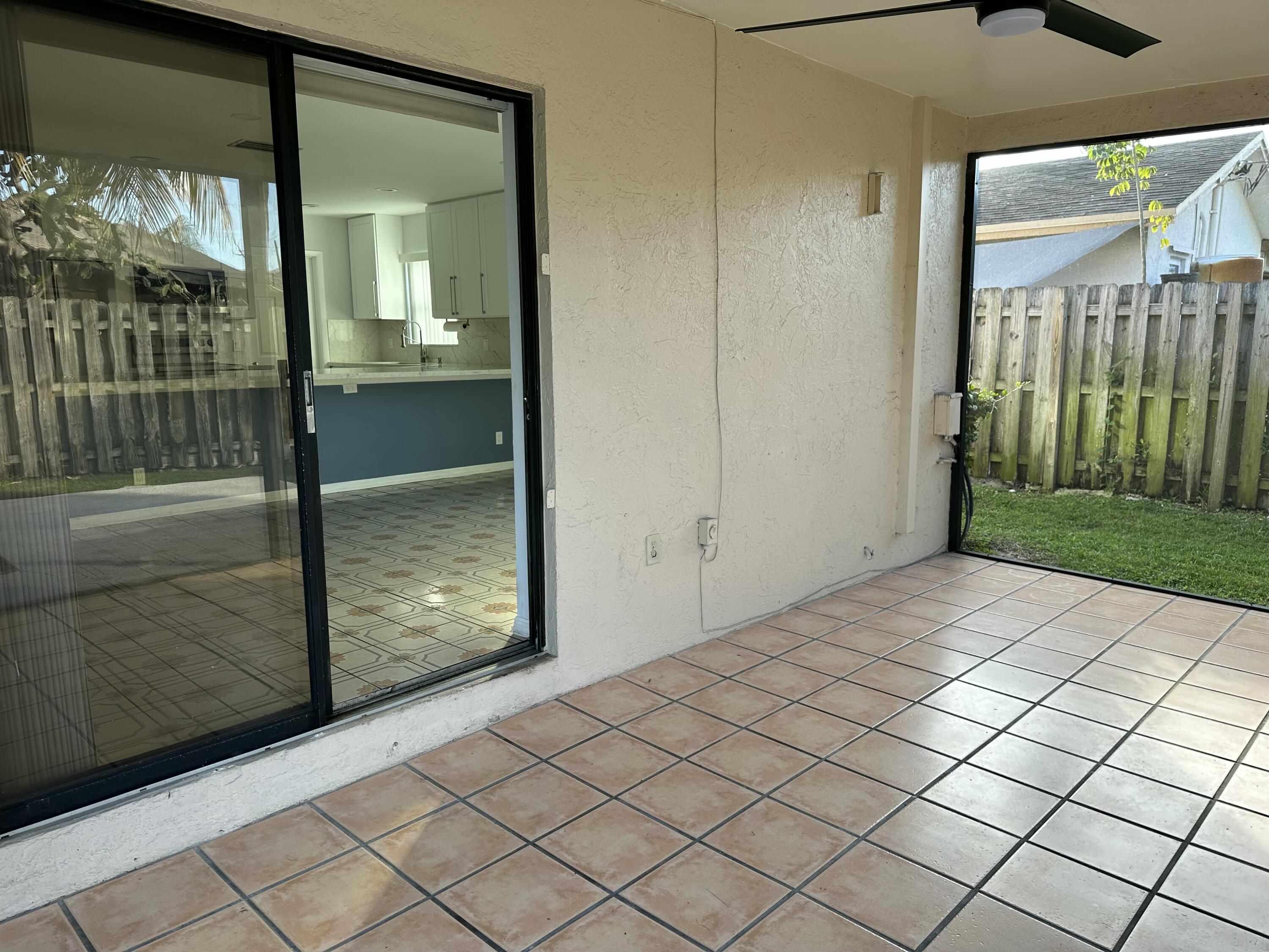 3291 Southwest 4th Street Deerfield Beach, FL 33442 - Photo 30 of 38 a view of a glass door