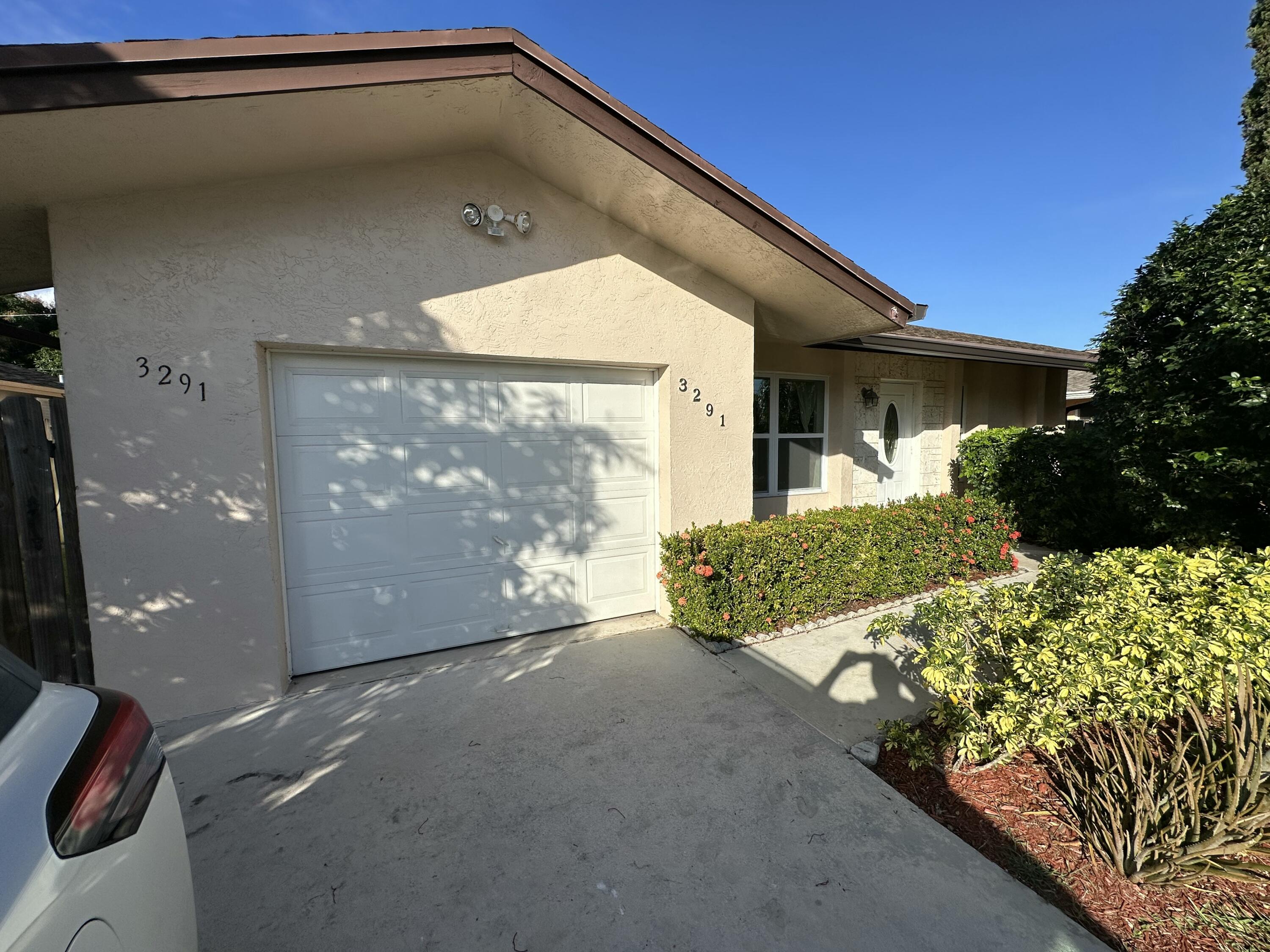 3291 Southwest 4th Street Deerfield Beach, FL 33442 - Photo 3 of 38 a view of a small garden