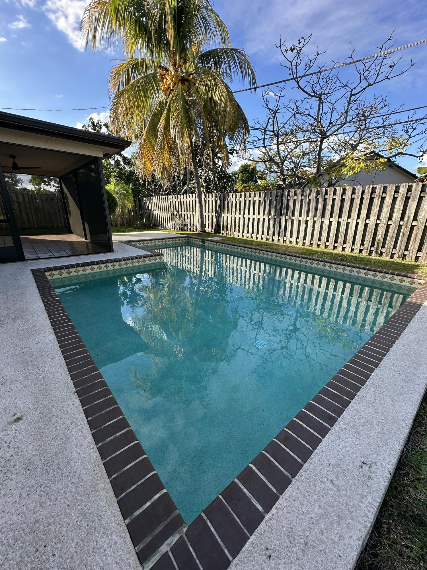 3291 Southwest 4th Street Deerfield Beach, FL 33442 - Photo 33 of 38 a view of a backyard with a patio