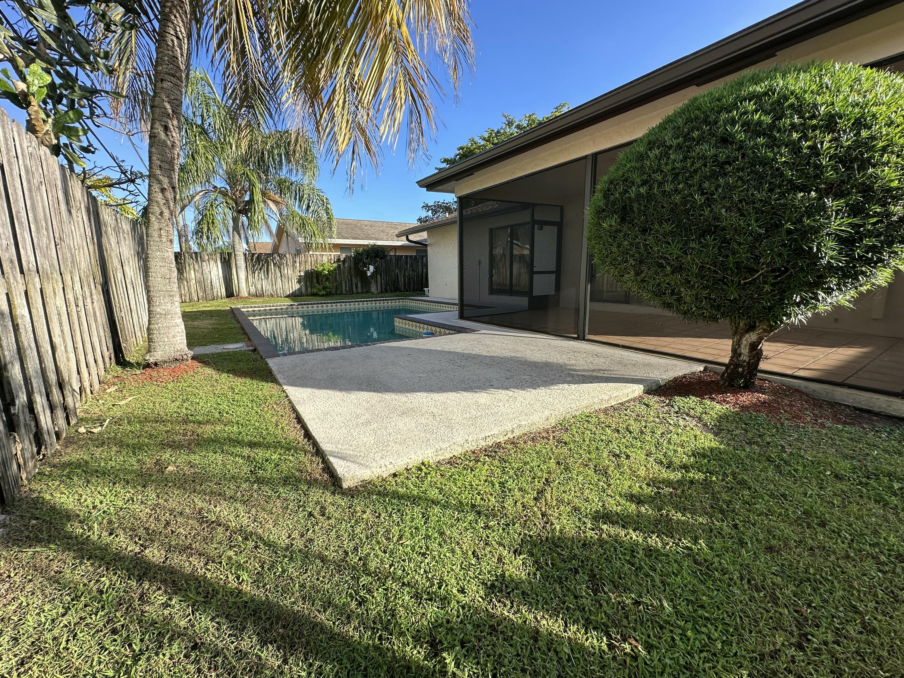 3291 Southwest 4th Street Deerfield Beach, FL 33442 - Photo 37 of 38 a view of a backyard with a tree