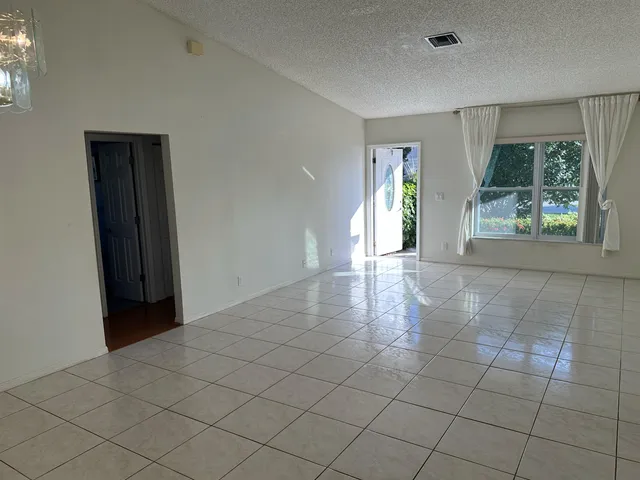 a view of kitchen with stainless steel appliances a sink and a stove top oven