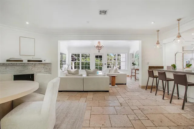 a bathroom with a granite countertop sink a toilet and a mirror