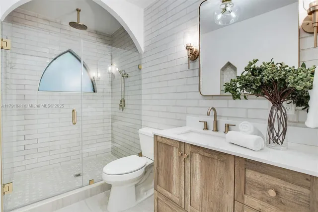 a bathroom with a bathtub and a shower