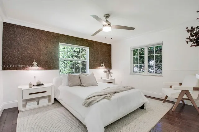 a bedroom with a bed and a couch