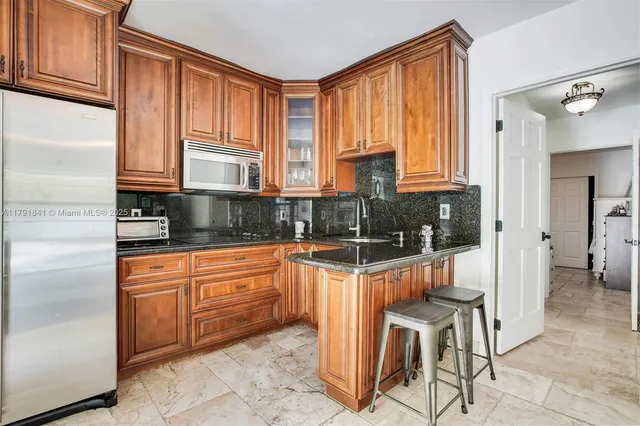 a view of a backyard with sitting area