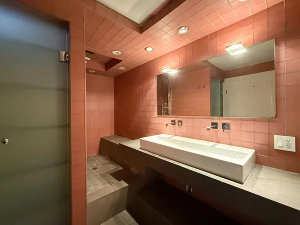 a bathroom with a sink and a mirror