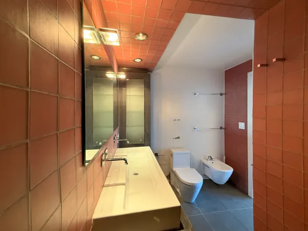 a bathroom with a tub and shower