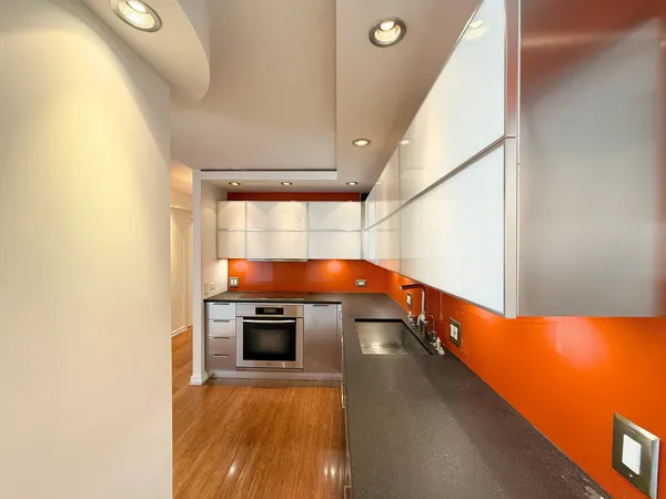 a view of a kitchen with a sink and a fireplace