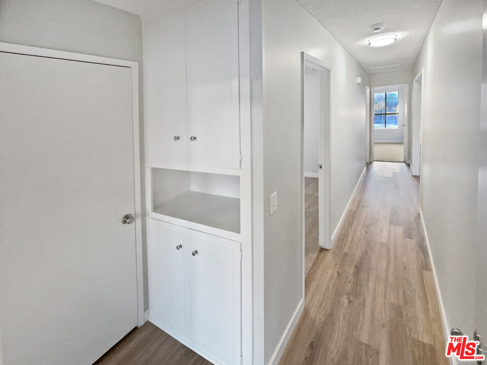 443 Pepper Tree Drive Brea, CA 92821 - Photo 12 of 26 a view of a hallway with wooden floor and entryway