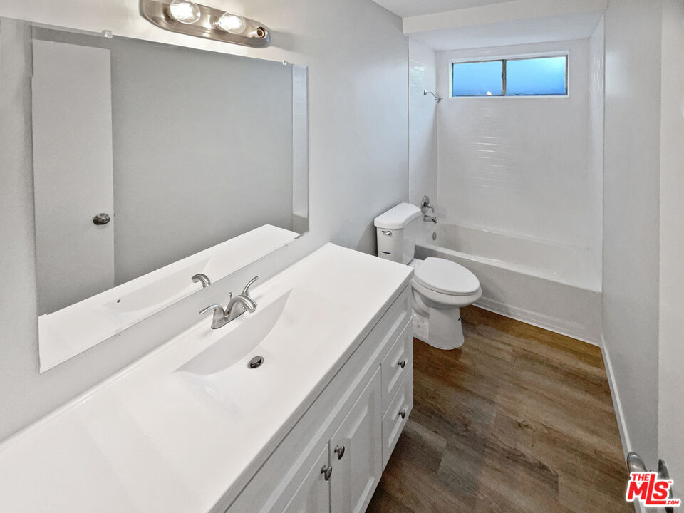 443 Pepper Tree Drive Brea, CA 92821 - Photo 13 of 26 a bathroom with a sink a toilet and shower