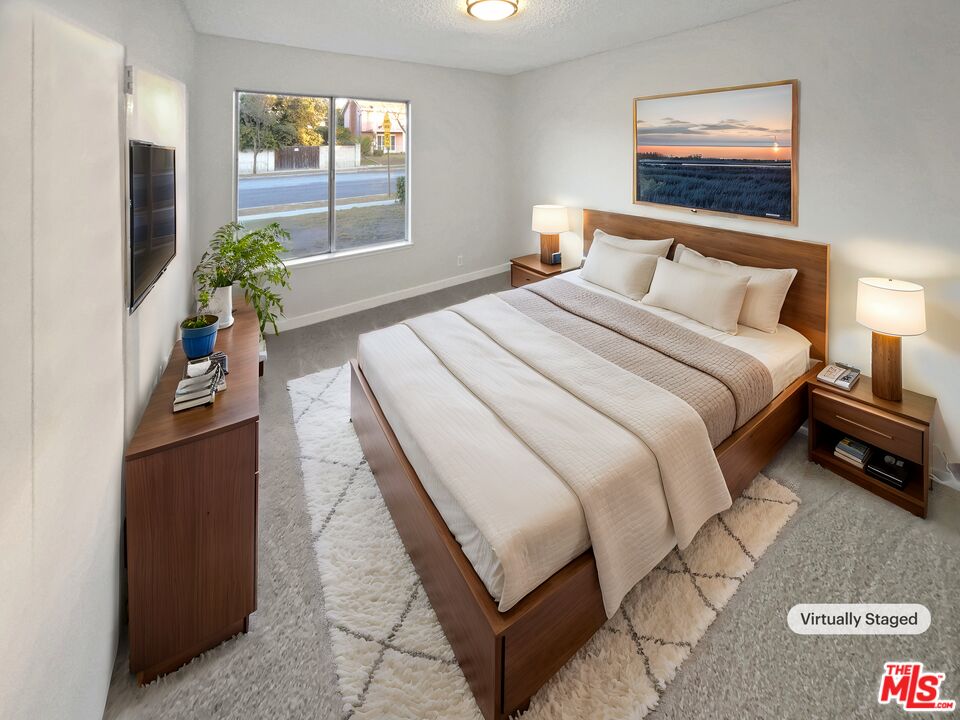 443 Pepper Tree Drive Brea, CA 92821 - Photo 4 of 26 a bedroom with a bed and a potted plant