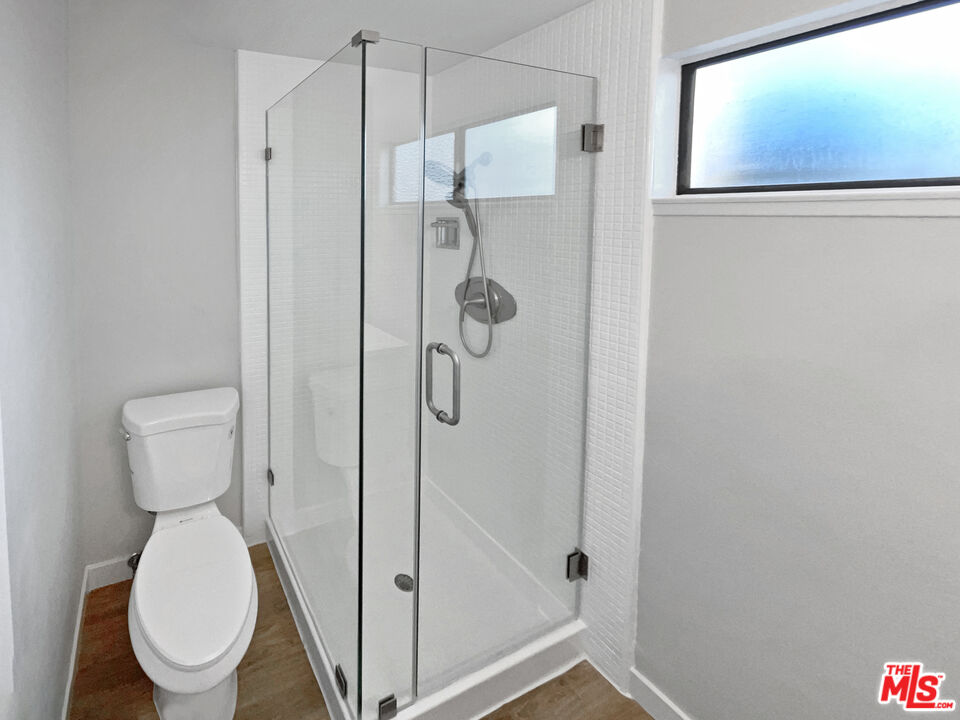 443 Pepper Tree Drive Brea, CA 92821 - Photo 7 of 26 a bathroom with a toilet and a shower