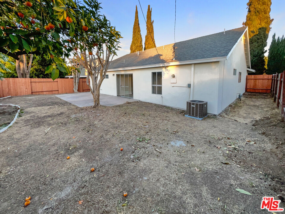 443 Pepper Tree Drive Brea, CA 92821 - Photo 8 of 26 a view of a white house with a yard and large tree