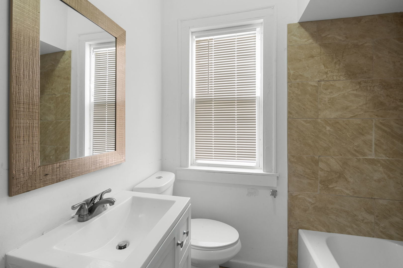 429 East 89th Street Chicago, IL 60619 - Photo 7 of 15 a bathroom with a sink a toilet and a bathtub