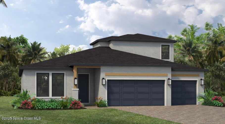 a front view of a house with a yard and garage