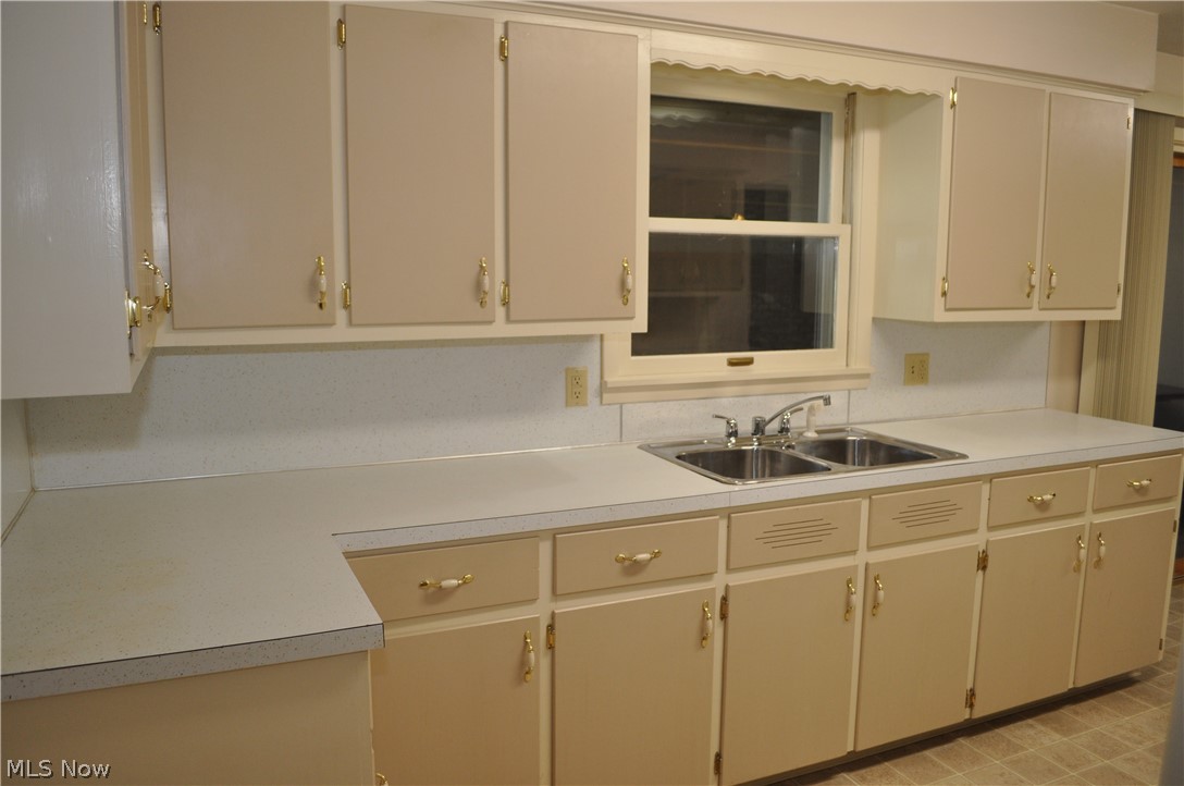 8262 Navarre Road Southwest Massillon, OH 44646 - Photo 5 of 26 kitchen with cabinets galore and counter space