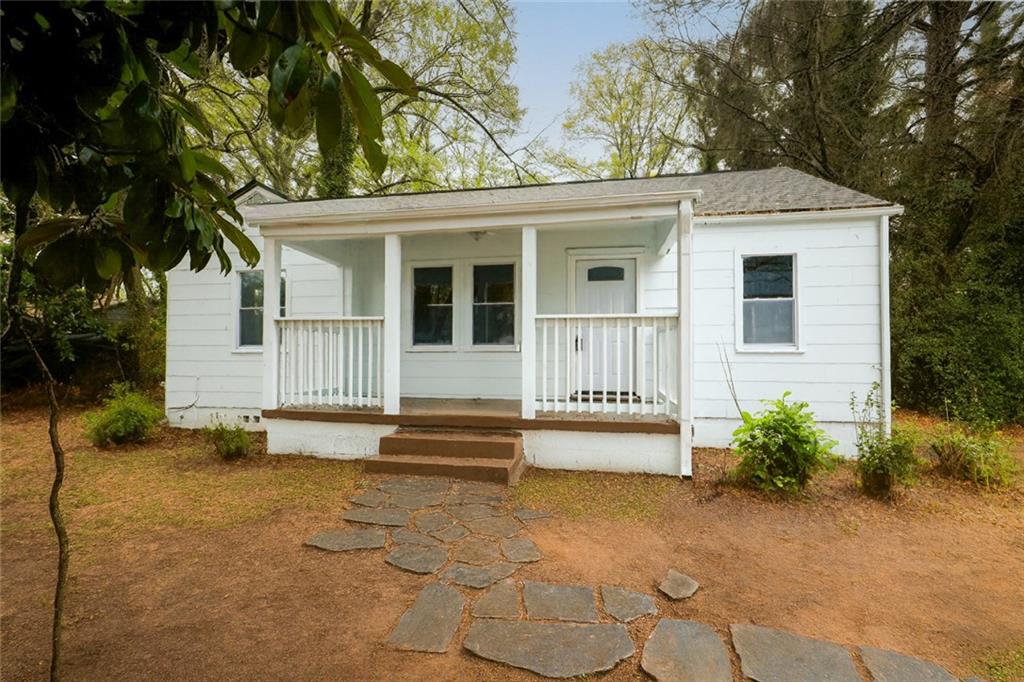 1944 Washington Road East Point, GA 30344 - Photo 1 of 14 a view of a house with backyard and sitting area